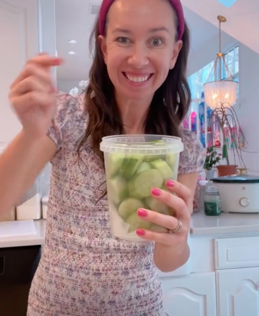 Shannon holding a container of prepared snacks for her kids from her blog: Mom Magic: These simple hacks make my life easier